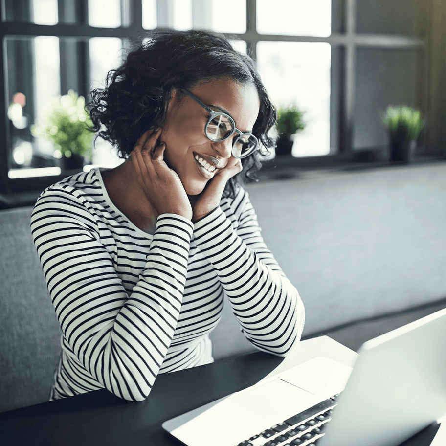 Young African woman smiling and chatting online